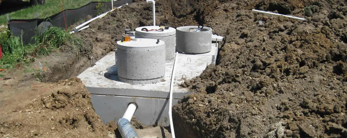 Septic system repair and installation site with tank access ports in Boston, MA